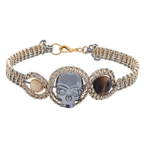 PULSERA KRANIO TEJIDA ALAMBRE C/DIJE GLOW GDE UNISEX